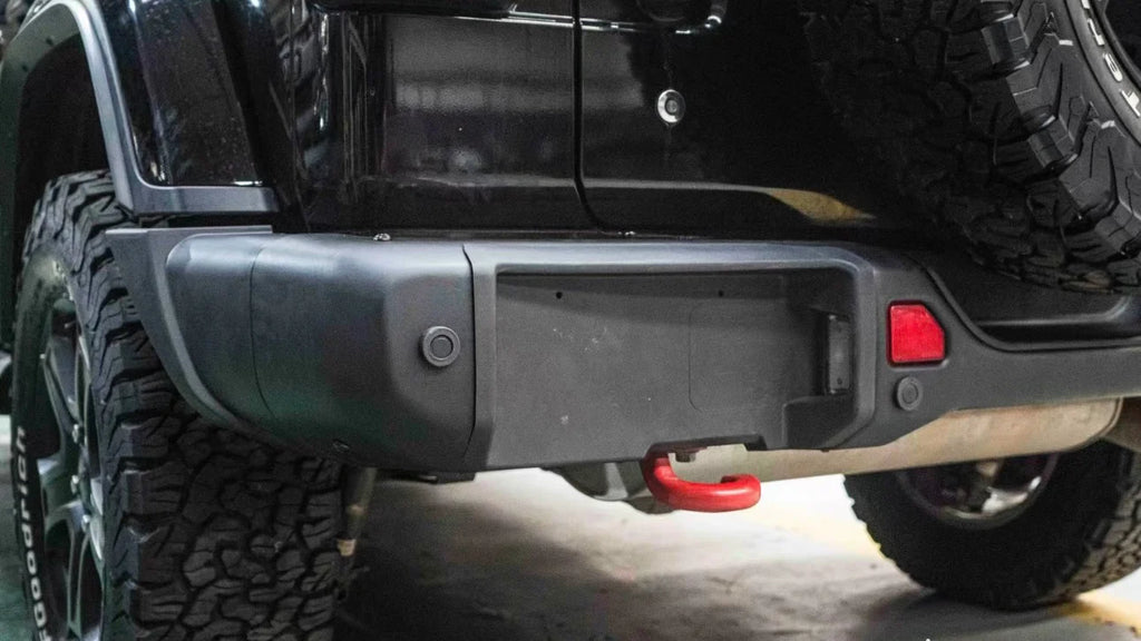 close-up of 2007–2018 Jeep Wrangler JK 10th Anniversary rear bumper installed on black Rubicon Wrangler