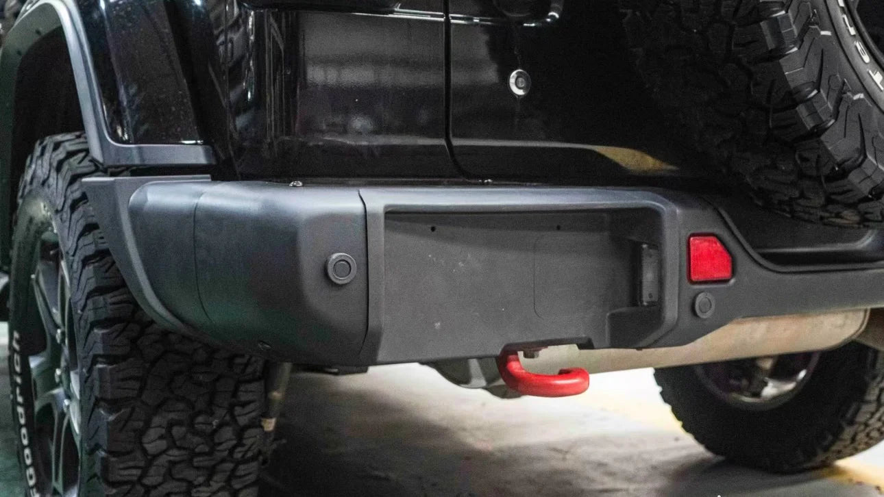 close-up of 2007–2018 Jeep Wrangler JK 10th Anniversary rear bumper installed on black Rubicon Wrangler