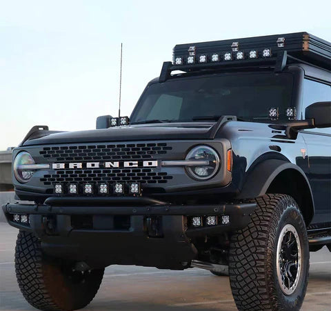close-up of 2021–2026 Ford Bronco modular front bumper installed on blue Bronco with LED lights